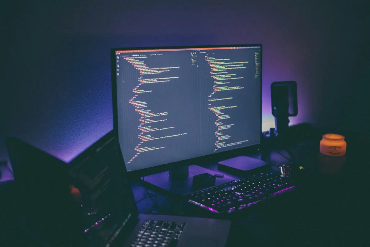 A software development workspace illuminated by code